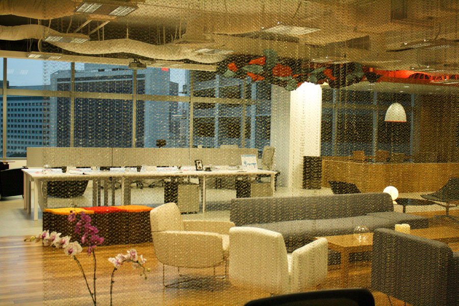 Woven metal mesh partitions and dividers in an office interior