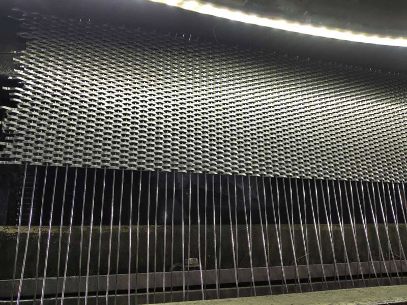 Woven metal fabric being produced on a weaving loom